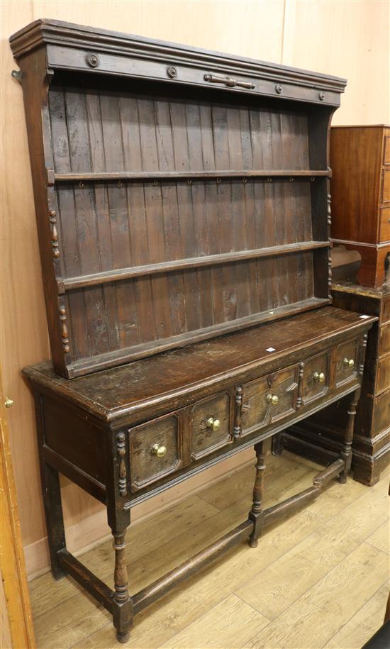 A 17th century style oak dresser W.153cm